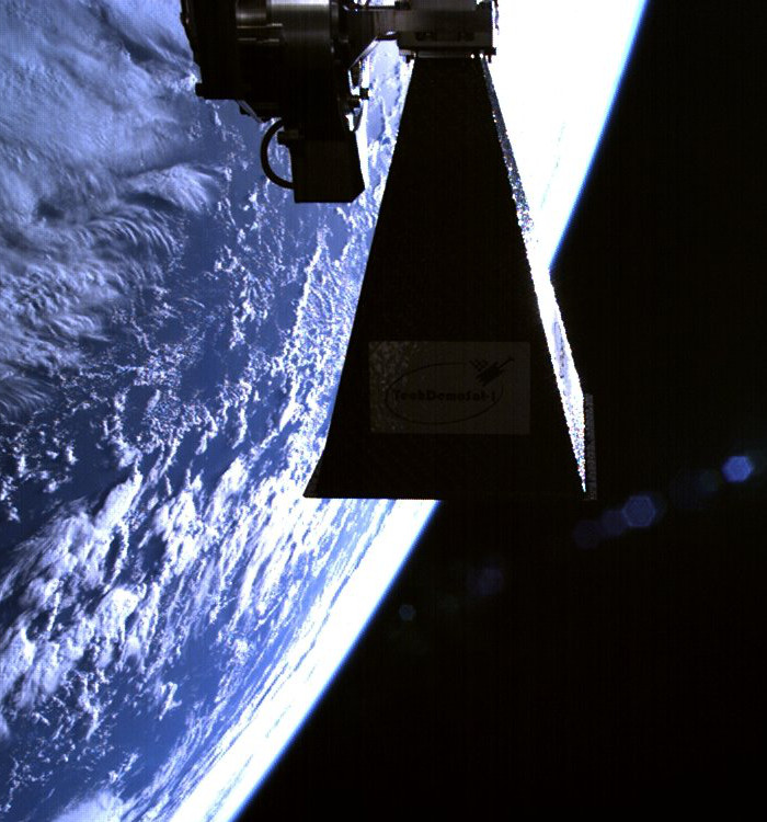 SSTL's TechDemoSat-1 satellite in orbit, showing steerable downlink horn antenna, July 2014.